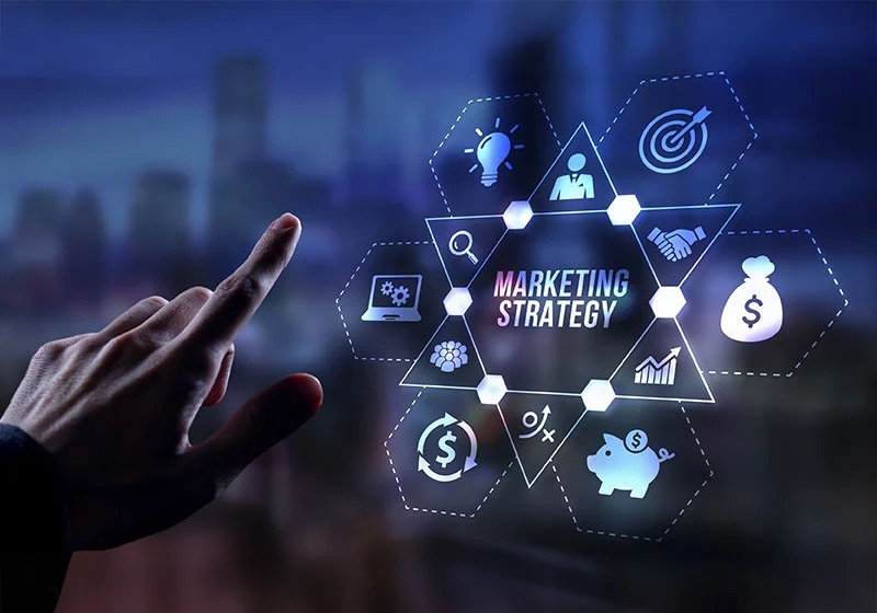 Hand interacting with a glowing marketing strategy diagram of connected strategy icons